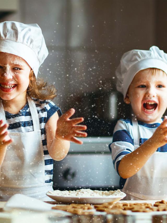 happy family  funny kids are preparing the dough, bake cookies in the kitchen