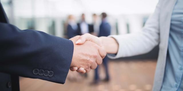 Close-up of businesspeople shaking hands