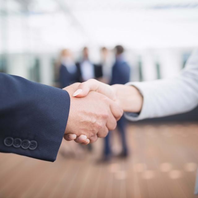 Close-up of businesspeople shaking hands